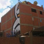 armed-with-small-scaffolding-rigs-and-many-many-cans-of-spray-paint-the-team-set-to-work-on-turning-the-intricate-illustration-into-a-mammoth-work-of-art